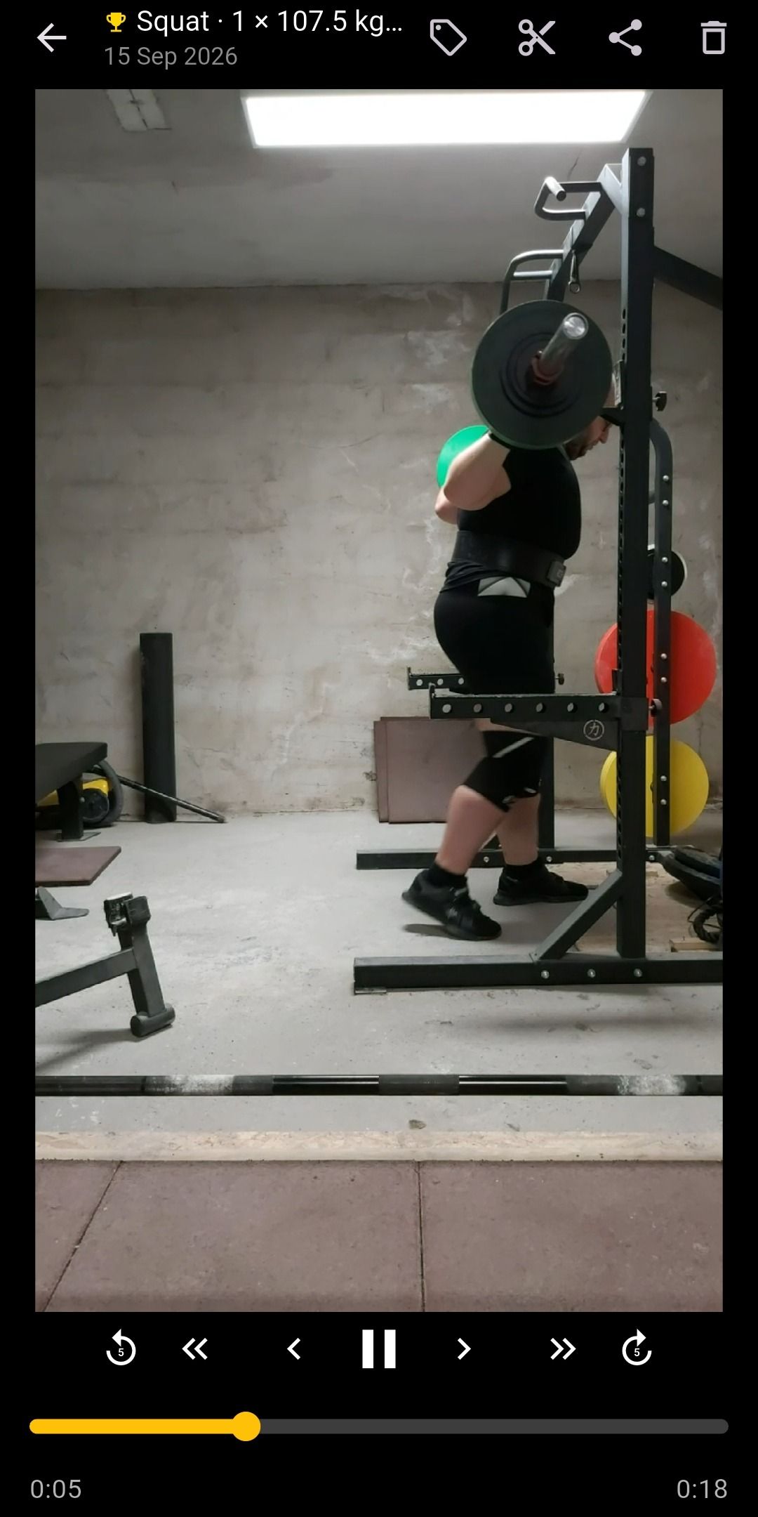 Watching a squat personal record in Lift Recorder, with frame-step, 1 and 5-second skip controls and a scrub bar
